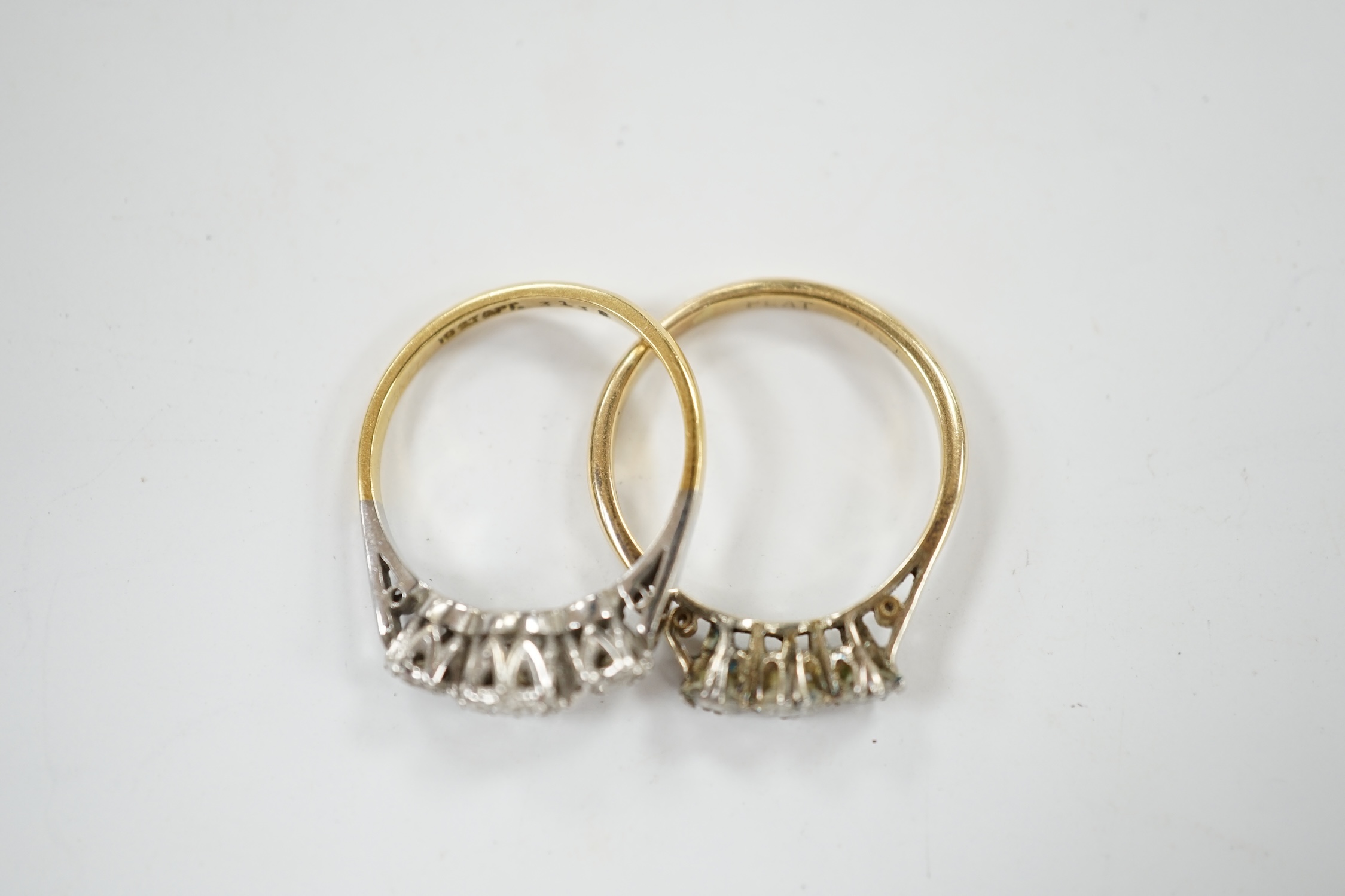 Two 18ct, plate and illusion set three stone diamond rings, sizes O & P, gross weight 6.3 grams. Condition - fair to good
